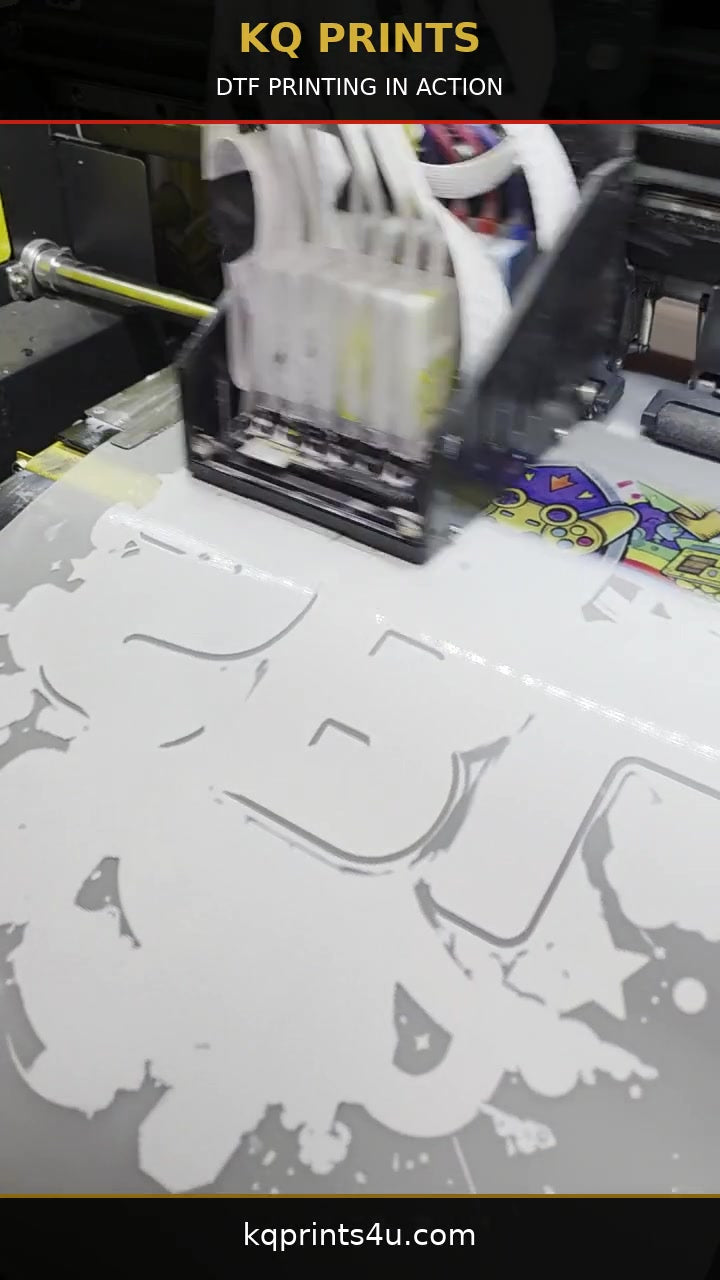 Load video: KQ Prints DTF printer applying ink to transfer film in a 16-second branded video.